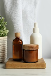 Different bath accessories and personal care products on light table