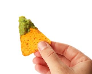 Woman holding delicious nachos chip with guacamole on white background, closeup