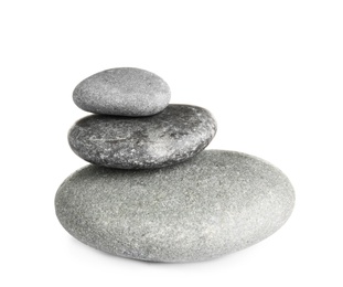 Stack of zen spa stones on white background