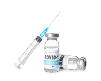 Photo of Vials with vaccine against coronavirus and syringe on white background