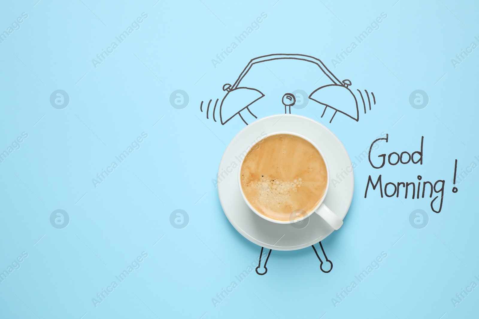 Photo of Composition with Good Morning wish and aromatic coffee on light blue background, top view. Space for text