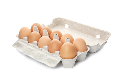 Photo of Carton of raw chicken eggs on white background