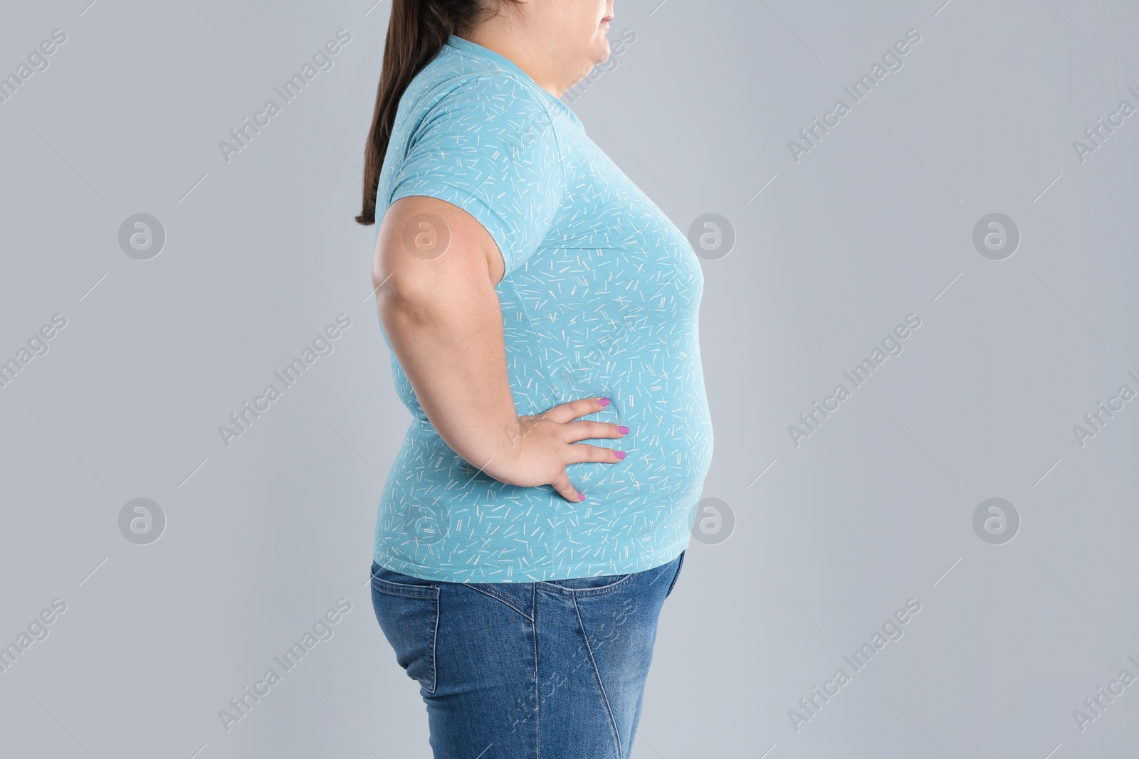 Photo of Overweight woman before weight loss on color background