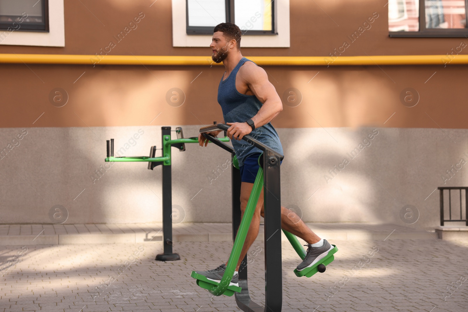 Photo of Man training on air walker at outdoor gym