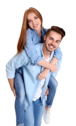 Photo of Young couple in stylish jeans on white background