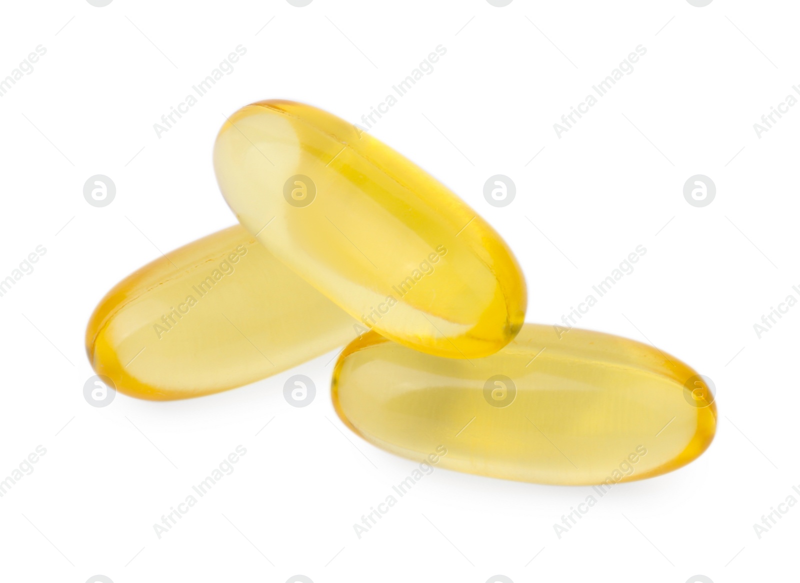 Photo of Yellow vitamin capsules isolated on white. Health supplements