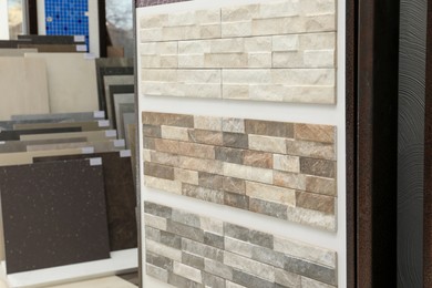 Photo of Many different samples of tiles on display in store