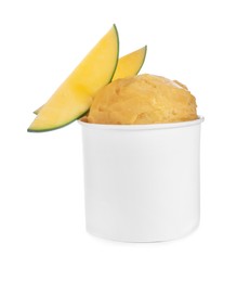 Photo of Delicious yellow ice cream with mango in paper cup isolated on white