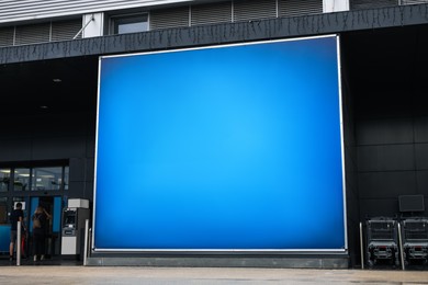 Big advertising banner on building facade outdoors