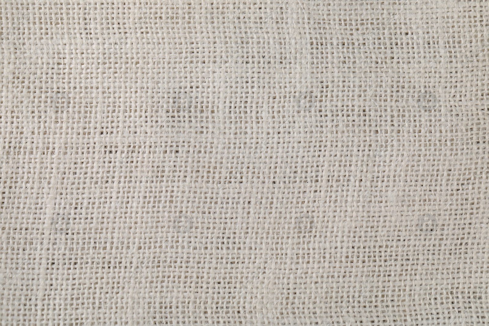 Photo of White burlap fabric as background, top view