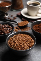 Bowls of beans, instant and ground coffee on grey table