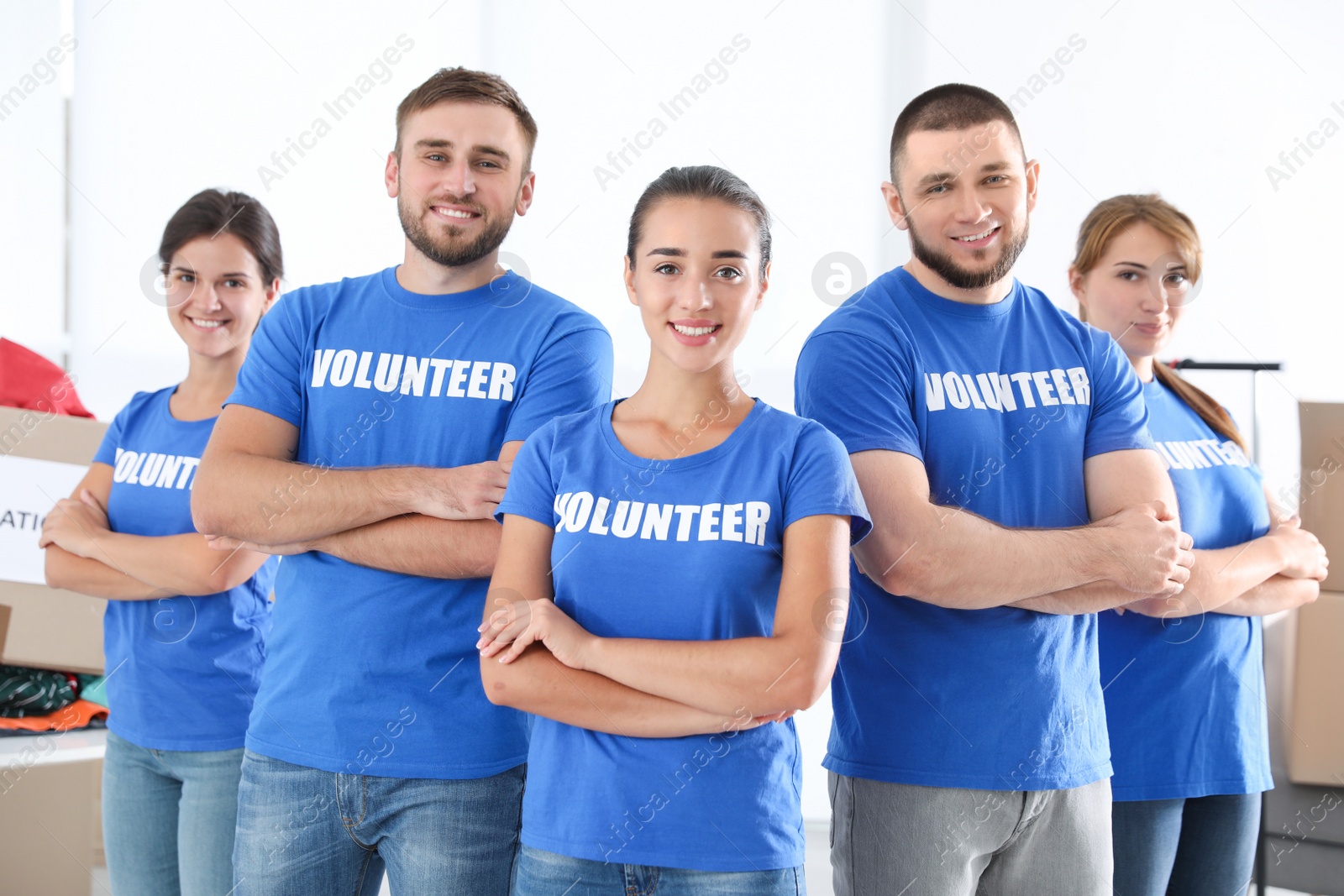 Photo of Team of young volunteers indoors. Collecting donations