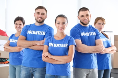 Team of young volunteers indoors. Collecting donations