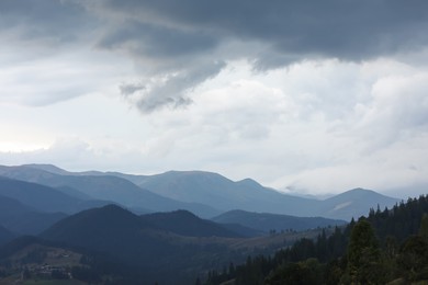 Beautiful view of majestic mountains under cloudy sky