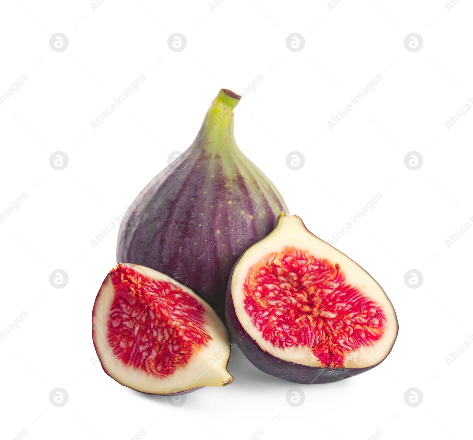 Photo of Whole and cut purple figs on white background