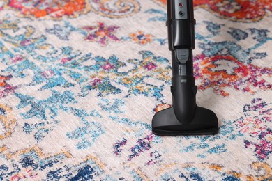 Hoovering carpet with vacuum cleaner, space for text
