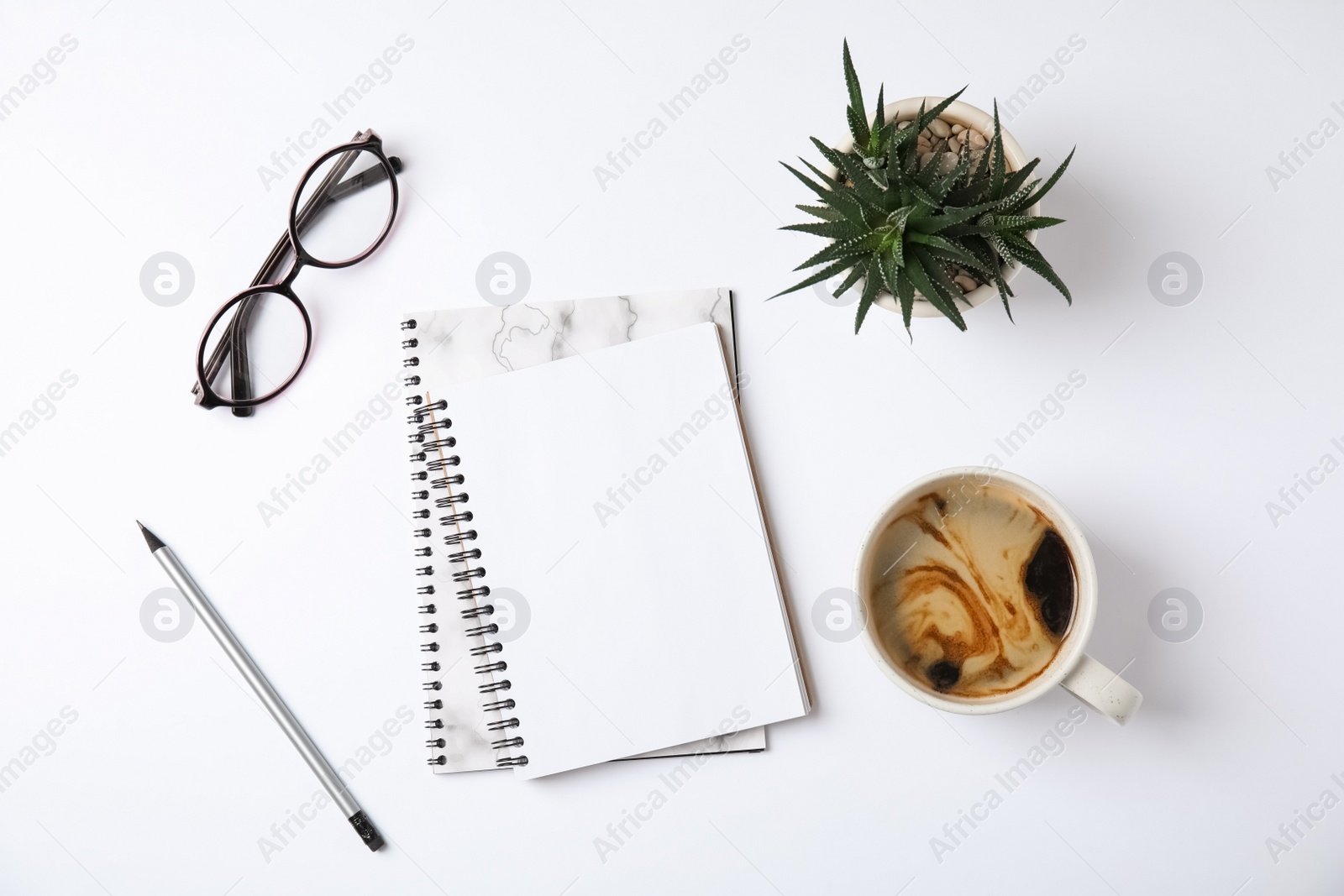 Photo of Flat lay composition with notebooks and coffee on white background