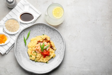 Photo of Flat lay composition with tasty shrimps and grits on grey background