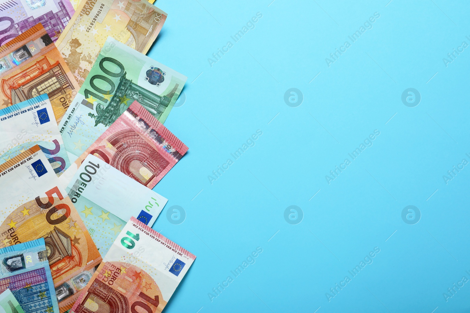 Image of Money on light blue background, flat lay. Space for text 