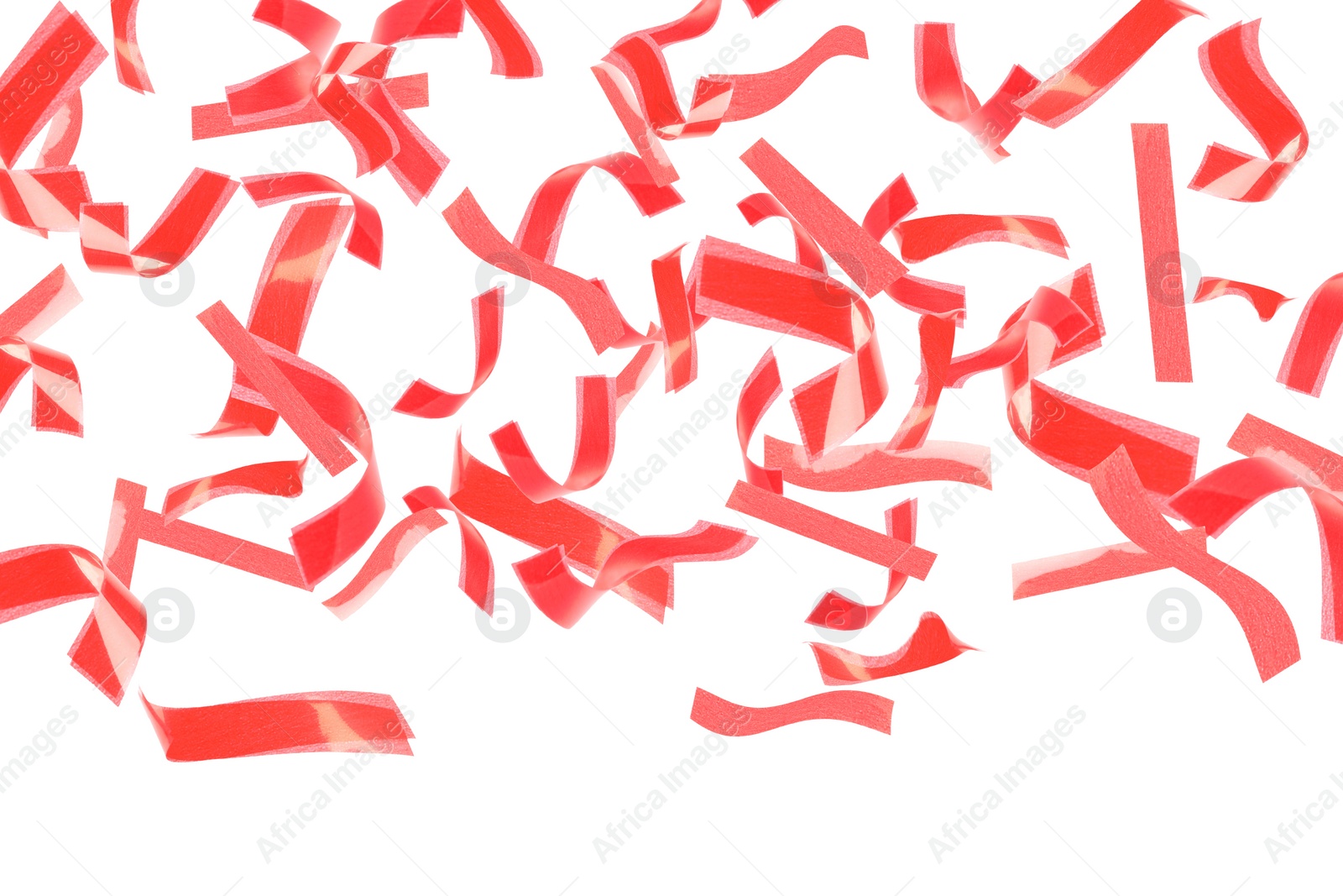 Image of Bright red confetti falling on white background