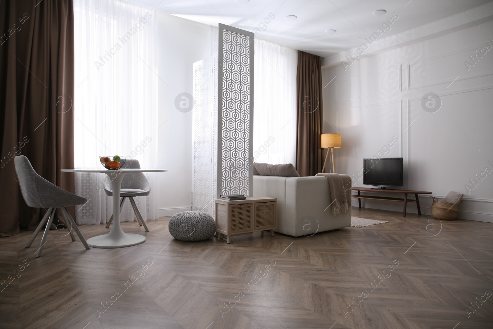 Photo of Modern living room with parquet floor and stylish furniture