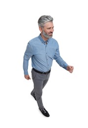 Photo of Mature businessman in stylish clothes posing on white background, above view