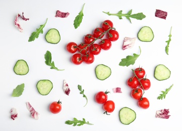 Photo of Fresh vegetables for salad on white background, top view