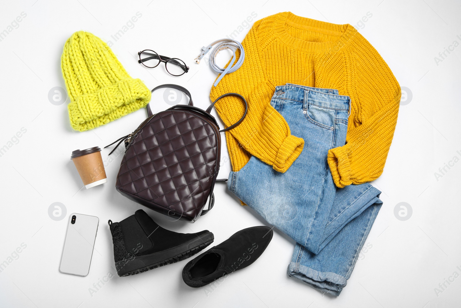 Photo of Set of stylish winter clothes on white background, top view