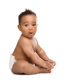 Adorable African-American baby in diaper on white background