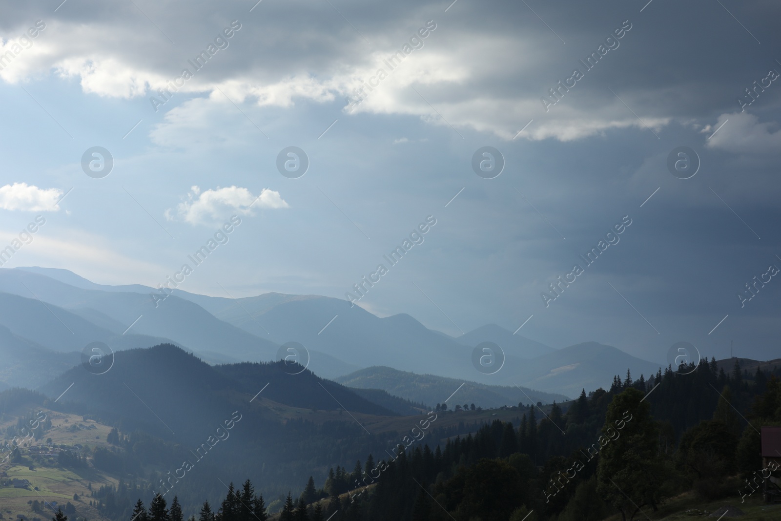 Photo of Beautiful view of majestic mountains under cloudy sky