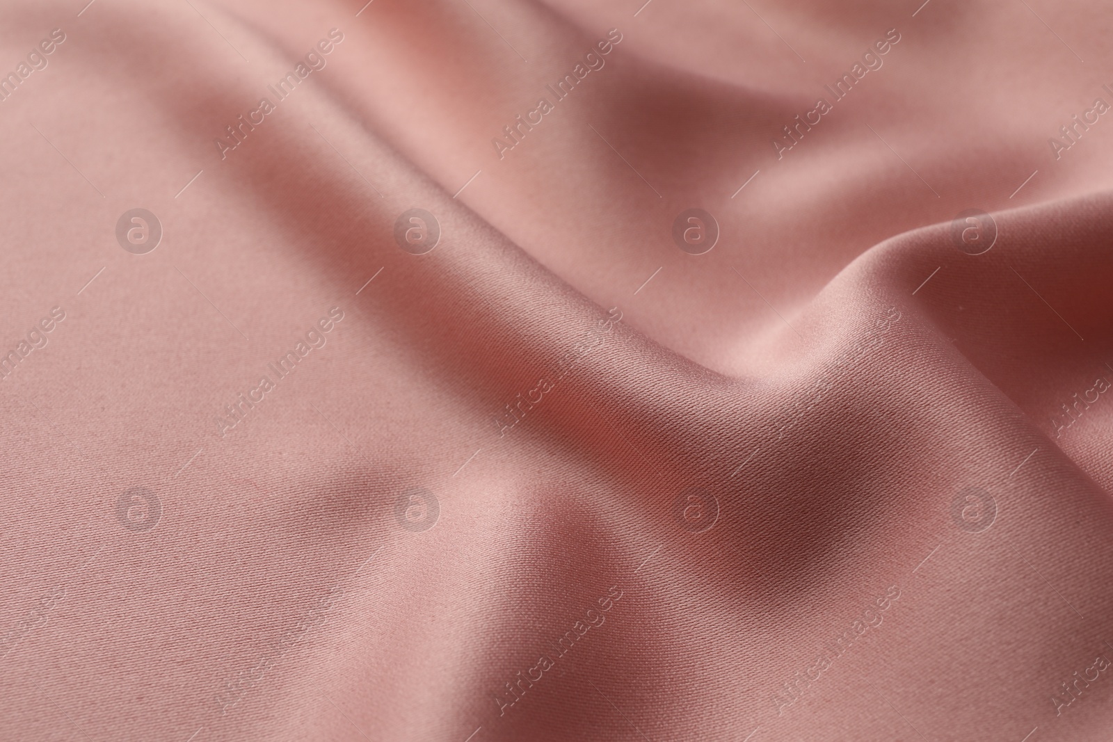 Photo of Texture of pink silk fabric as background, closeup