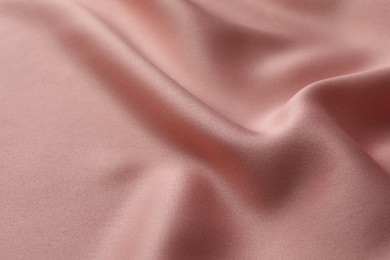 Texture of pink silk fabric as background, closeup