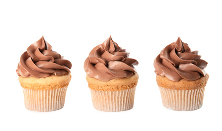 Delicious birthday cupcakes decorated with cream on white background