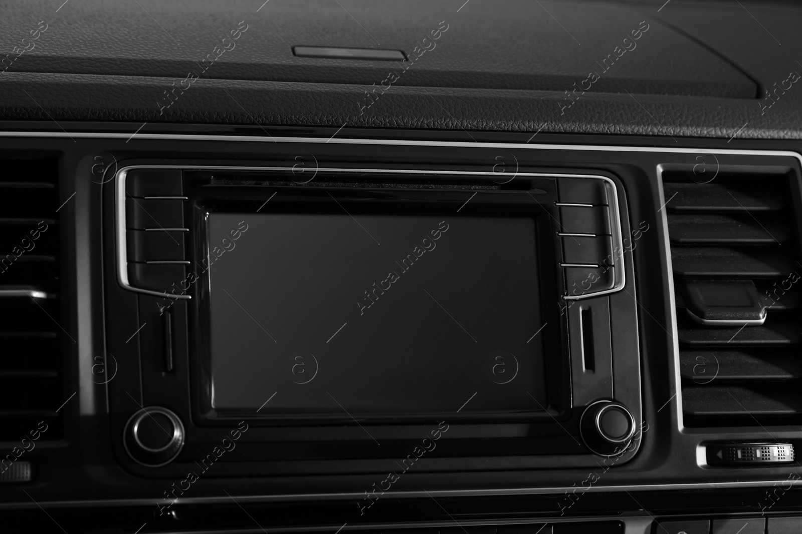 Photo of Closeup view of dashboard with navigation system in modern car