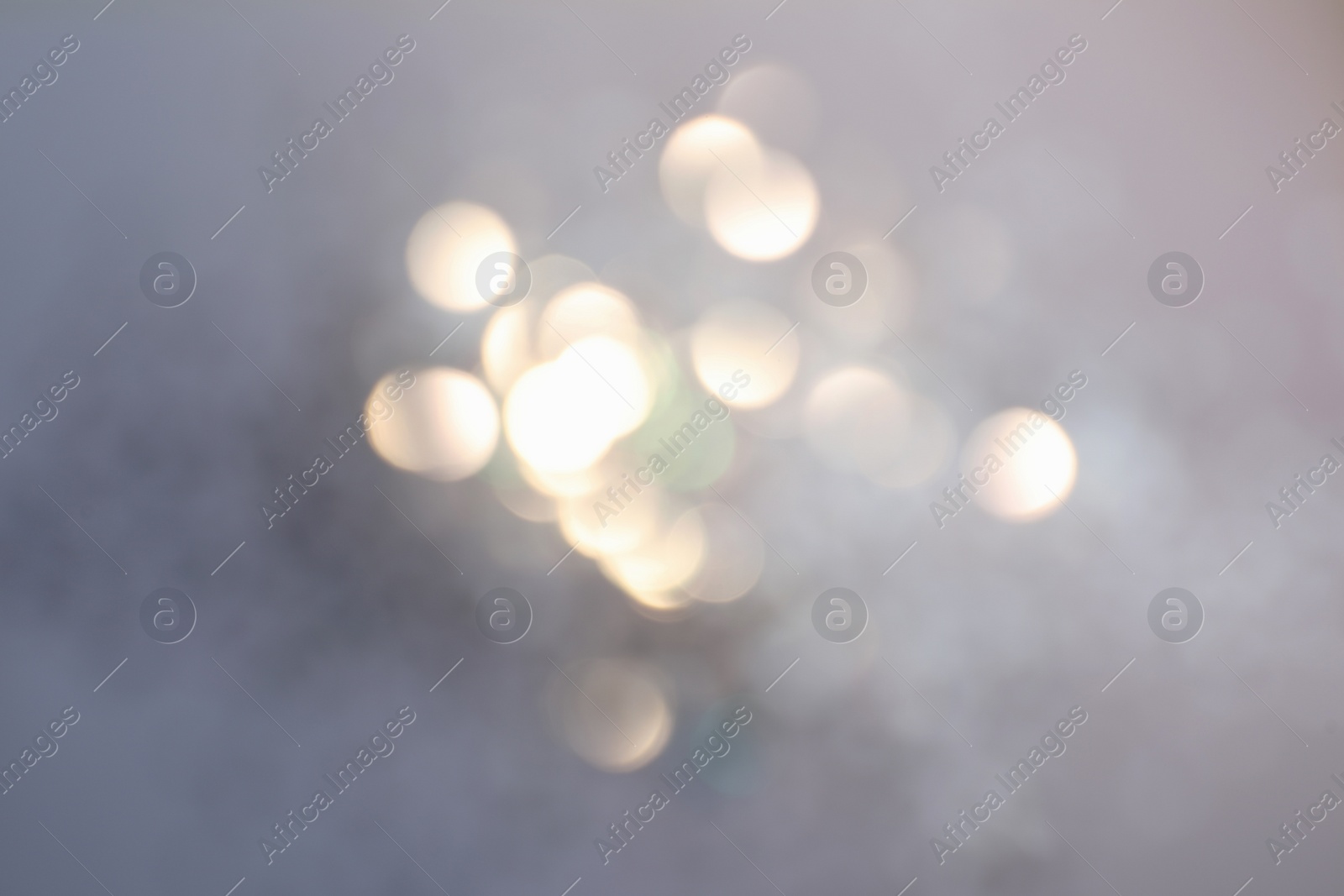 Photo of Shiny lilac background with magical bokeh effect