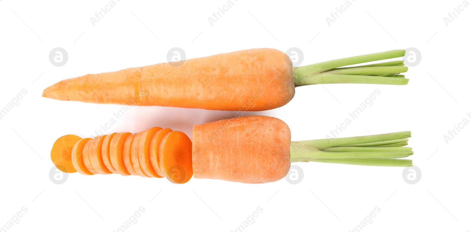 Photo of Whole and cut ripe carrots isolated on white, top view