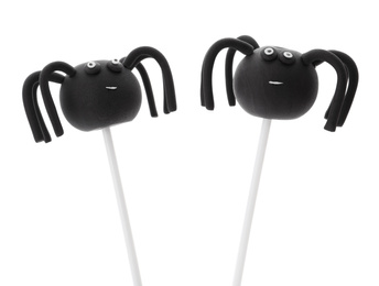 Photo of Delicious spider cake pops on white background. Halloween season