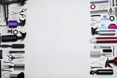 Photo of Set of professional hairdresser's tools on light background, flat lay. Space for text