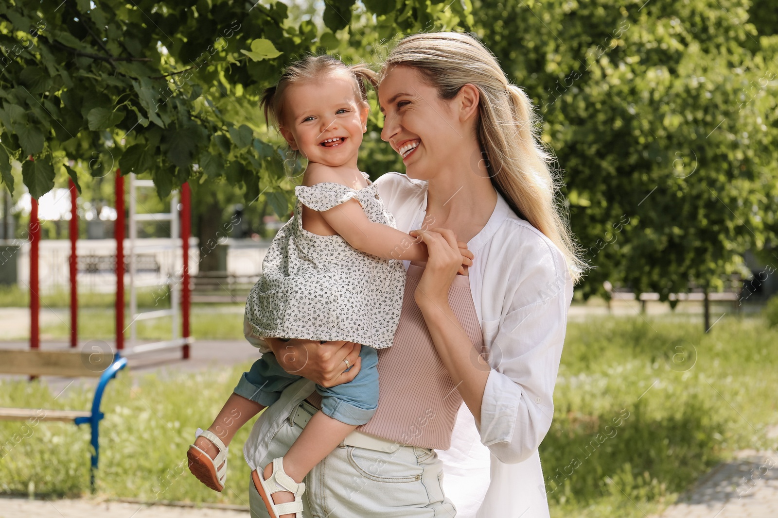 Photo of Happy mother with her daughter spending time together in park