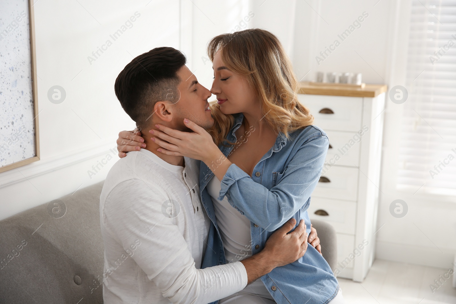 Photo of Lovely couple enjoying time together at home