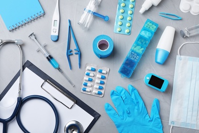 Photo of Flat lay composition with medical objects on grey background