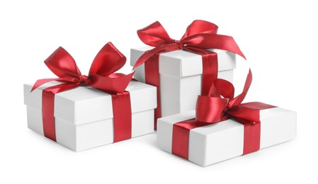 Photo of Many boxes with Christmas gifts on white background