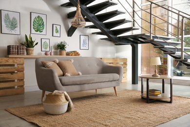 Modern comfortable sofa in stylish living room interior