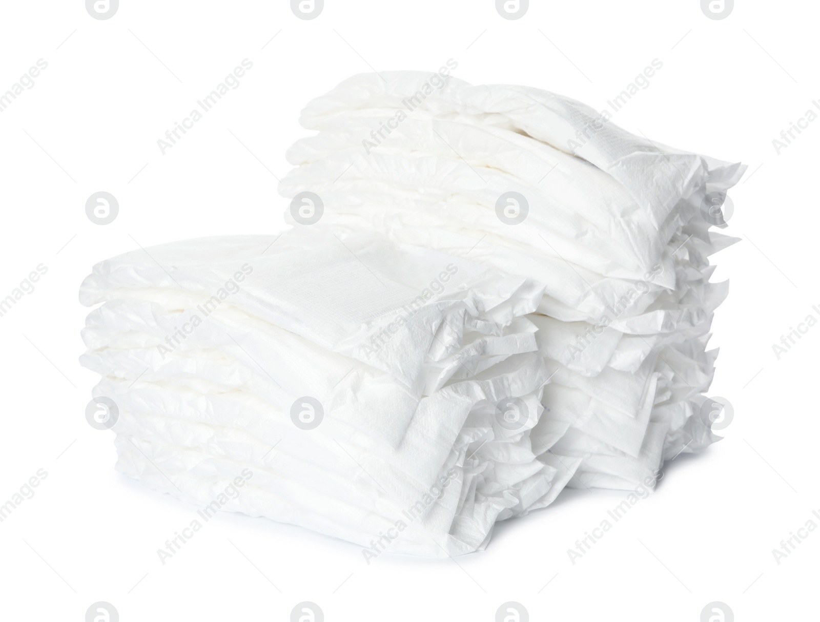 Photo of Stacks of baby diapers isolated on white