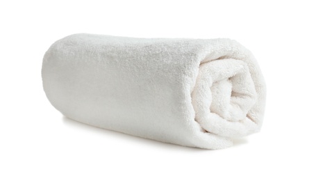 Photo of Rolled soft terry towel on white background