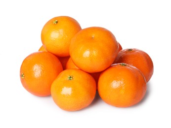 Photo of Many fresh ripe tangerines isolated on white