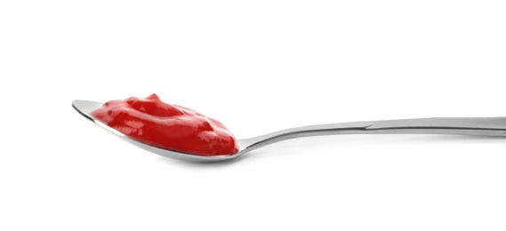 Photo of Tasty homemade tomato sauce in spoon on white background