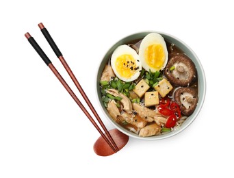 Photo of Bowl of delicious ramen and chopsticks isolated on white, top view. Noodle soup