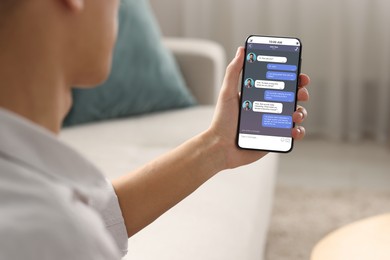 Man texting via mobile phone at indoors, closeup. Device screen with messages