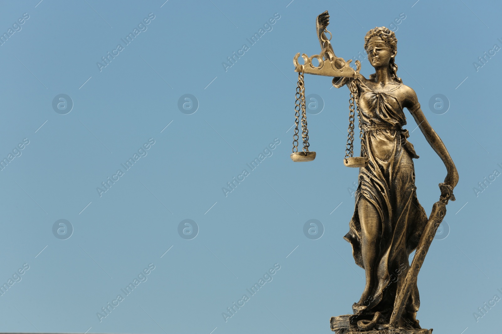 Photo of Figure of Lady Justice against sky, space for text. Symbol of fair treatment under law